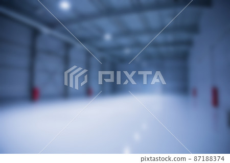 Blured background of big empty modern storehouse in blue tones 87188374