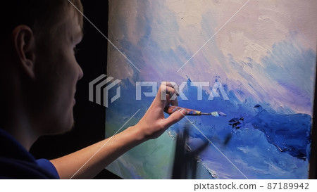 Artist copyist paint seascape with ship in ocean. Craftsman decorator draw as boat sail on blue sea with acrylic oil color. Draw brush, knife palette. Artist copyist paint seascape with ship in ocean. Craftsman decorator draw as boat sail on blue sea with acrylic oil color. Draw brush, knife palette. 87189942