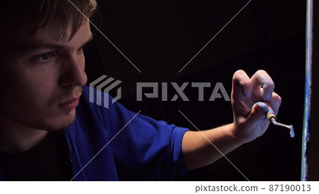 Artist copyist paint seascape with ship in ocean. Craftsman decorator draw as boat sail on blue sea with acrylic oil color. 87190013