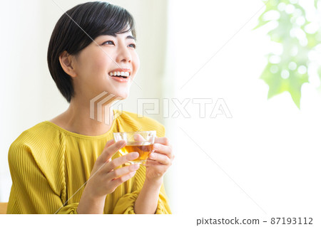 Young women drinking tea Drink tea Relaxing health Tea time 87193112