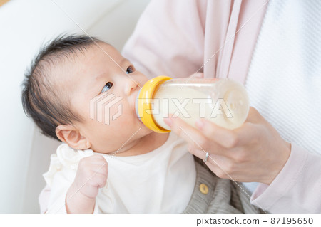 Baby up drinking milk Baby up drinking milk 87195650