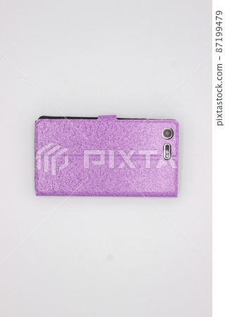 Phone in pink case on gray background 87199479