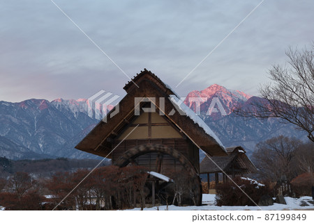 Mukawa-cho, Hokuto City, a watermill with snow and Mt. Kaikoma dawning Mukawa-cho, Hokuto City, a watermill with snow and Mt. Kaikoma dawning 87199849
