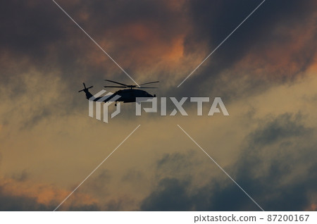 Helicopter flying in the evening Helicopter flying in the evening 87200167