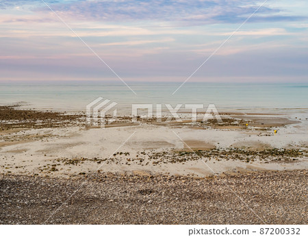 Normandy seascape, gorgeous pastel colors during low tide at sunset, northern France 87200332