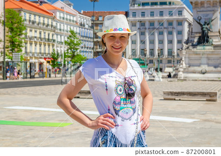 Young beautiful woman traveler with white hat on vacation Young beautiful woman traveler with white hat on vacation 87200801