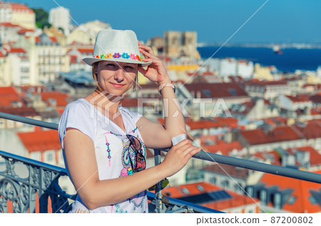 Young beautiful woman traveler with white hat on vacation Young beautiful woman traveler with white hat on vacation 87200802
