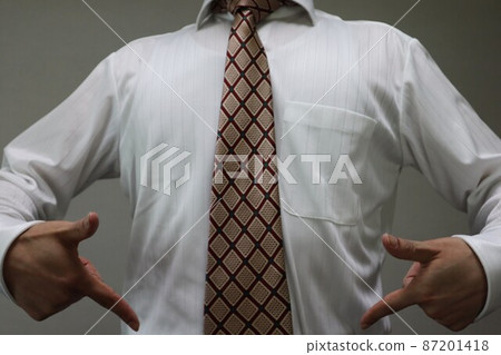 A businessman who succeeds in dieting and poses A businessman who succeeds in dieting and poses 87201418
