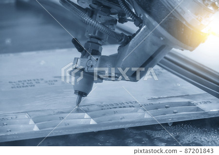 The multi-axis waterjet cutting machine with NC code data background. 87201843