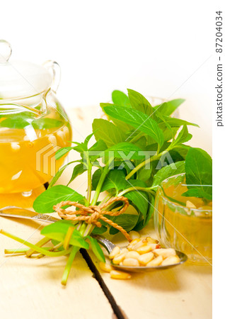 Arab traditional mint and pine nuts tea Arab traditional mint and pine nuts tea 87204034