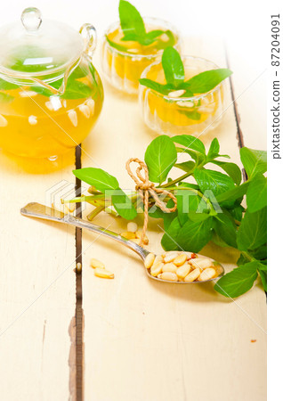 Arab traditional mint and pine nuts tea Arab traditional mint and pine nuts tea 87204091