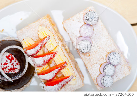 selection of fresh cream cake dessert plate 87204100