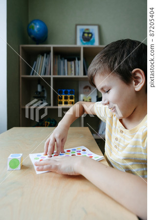 Child playing diy dot game for fingers 87205404
