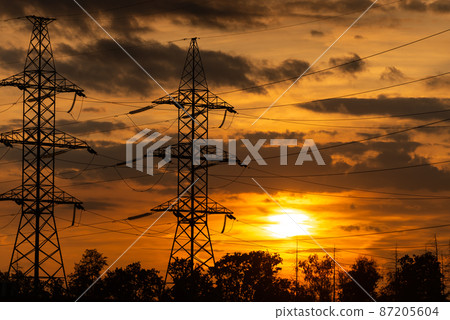 Power lines in the setting sun 87205604