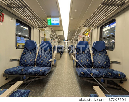 Empty blue seats inside polish train Empty blue seats inside polish train 87207304