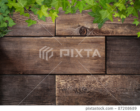 Natural background of wood grain and ivy 87208689