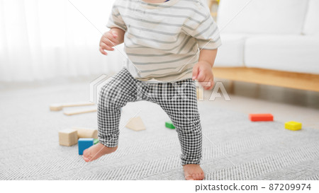 Baby playing with building blocks Baby playing with building blocks 87209974