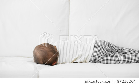 Baby sleeping on the sofa Baby sleeping on the sofa 87210264