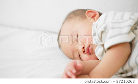 Baby sleeping on the sofa Baby sleeping on the sofa 87210268