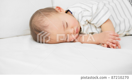 Baby sleeping on the sofa Baby sleeping on the sofa 87210270
