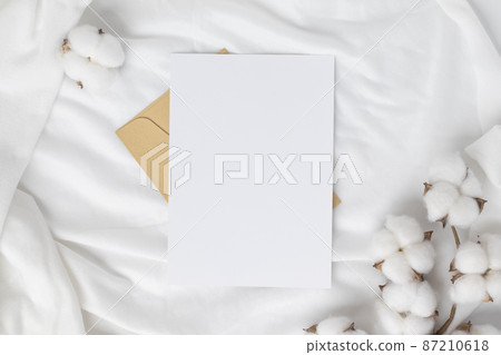 Blank greeting card invitation Mockup on Brown envelope with cotton flower on white background, Minimal table workplace composition, flat lay, mockup Blank greeting card invitation Mockup on Brown envelope with cotton flower on white background, Minimal table workplace composition, flat lay, mockup 87210618