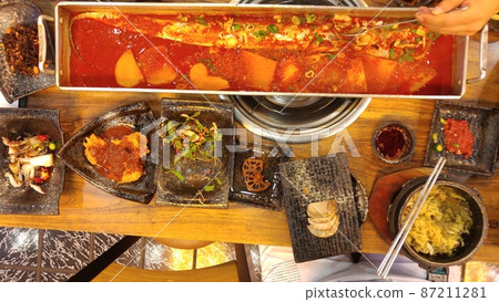 Braised cutlassfish served with various side dishes Braised cutlassfish served with various side dishes 87211281