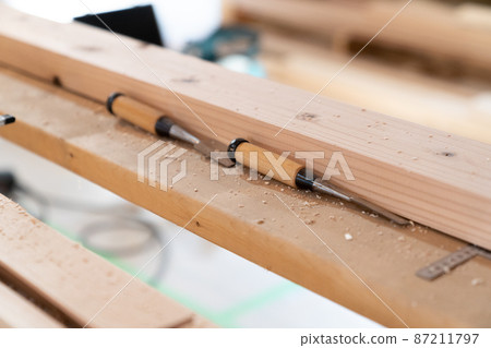 Wood placed at a wooden construction site 87211797