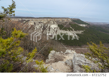 View of valley and mountain Besh-Kosh from plateau Burunchak near cavetown Chufut-Kale. Bakhchysarai, Crimea View of valley and mountain Besh-Kosh from plateau Burunchak near cavetown Chufut-Kale. Bakhchysarai, Crimea 87212752