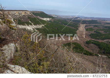View of valley from mountain plateau Burunchak near cavetown Chufut-Kale. Bakhchysarai, Crimea View of valley from mountain plateau Burunchak near cavetown Chufut-Kale. Bakhchysarai, Crimea 87212753