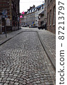 Cobblestone sidewalk back street 87213797