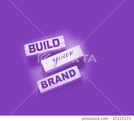 Phrase BUILD YOUR BRAND written on wooden blocks. With vintage styled background. Branding rebranding marketing concept Phrase BUILD YOUR BRAND written on wooden blocks. With vintage styled background. Branding rebranding marketing concept 87215173