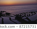 Sunset over rice terraces in the Sea of Japan 87215731