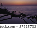 Sunset over rice terraces in the Sea of Japan 87215732