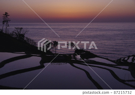 Sunset over rice terraces in the Sea of Japan Sunset over rice terraces in the Sea of Japan 87215732