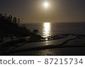 Sunset over rice terraces in the Sea of Japan 87215734