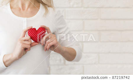 close up woman with little heart 87219742