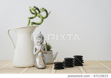 buddha figure front bamboo plant volcanic stones buddha figure front bamboo plant volcanic stones 87219815