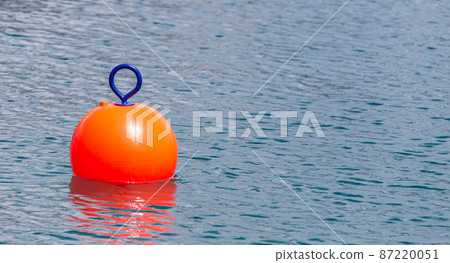 Red Buoy for safety swimming in water Red Buoy for safety swimming in water 87220051