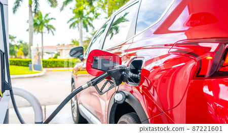 Car refueling on petrol station. Fuel pump with gasoline. Service is filling gas or diesel into tank 87221601