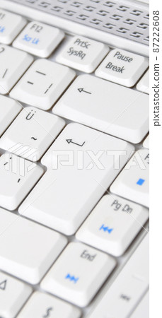 A white color laptop and Q keyboard detail A white color laptop and Q keyboard detail 87222608