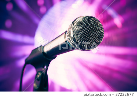 microphone against purple disco background 87222677