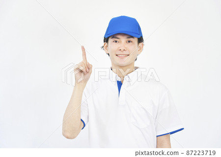Men's hat and polo shirt uniform pointing white background Men's hat and polo shirt uniform pointing white background 87223719