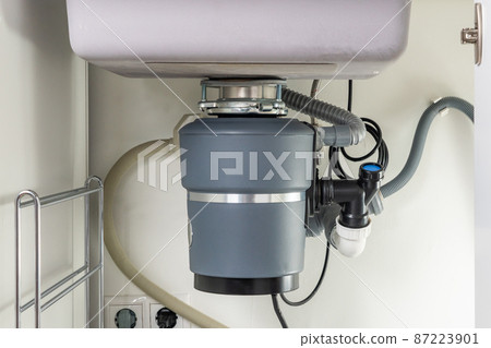 Garbage Disposal under the modern sink, waste chopper concept 87223901