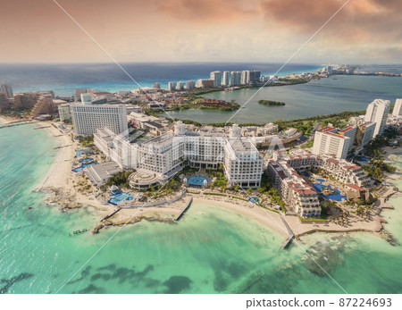 View of beautiful Hotels in the hotel zone of Cancun at sunset. Riviera Maya region in Quintana roo on Yucatan Peninsula View of beautiful Hotels in the hotel zone of Cancun at sunset. Riviera Maya region in Quintana roo on Yucatan Peninsula 87224693