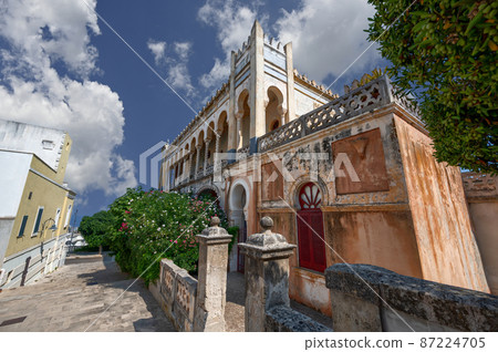 Santa Cesarea Terme, Puglia, Italy. August 2021. Amazing View of Palazzo Sticchi, the 19th century Moorish style villa symbol of the city. Santa Cesarea Terme, Puglia, Italy. August 2021. Amazing View of Palazzo Sticchi, the 19th century Moorish style villa symbol of the city. 87224705