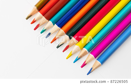 Close-up macro shot of colored pencils of a pile of pencils. Place for an inscription. 87226505