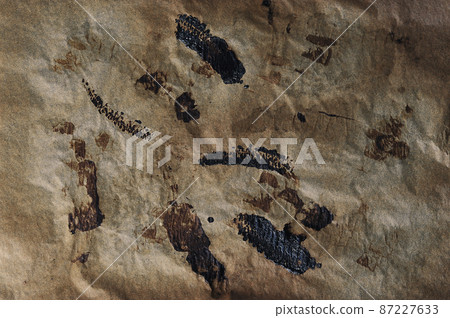abstract background - burnt parchment paper abstract background - burnt parchment paper 87227633