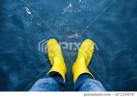 rubber boots in the water 87229470