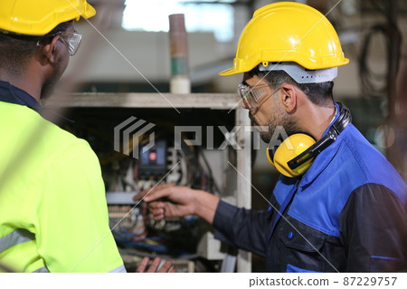 The factory engineer configures a complex production plantThe factory engineer configures a complex production plant 87229757