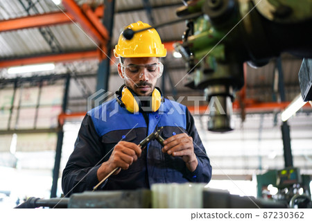 Professional men engineer worker skills quality, maintenance, training industry factory worker , warehouse Workshop for factory operators, mechanical engineering team production. 87230362